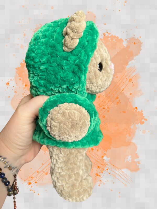 Tan crochet bear plushie in a green hoodie - right view