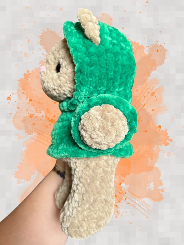 Tan crochet bear plushie in a green hoodie - left view