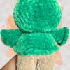Tan crochet bear plushie in a green hoodie - back view