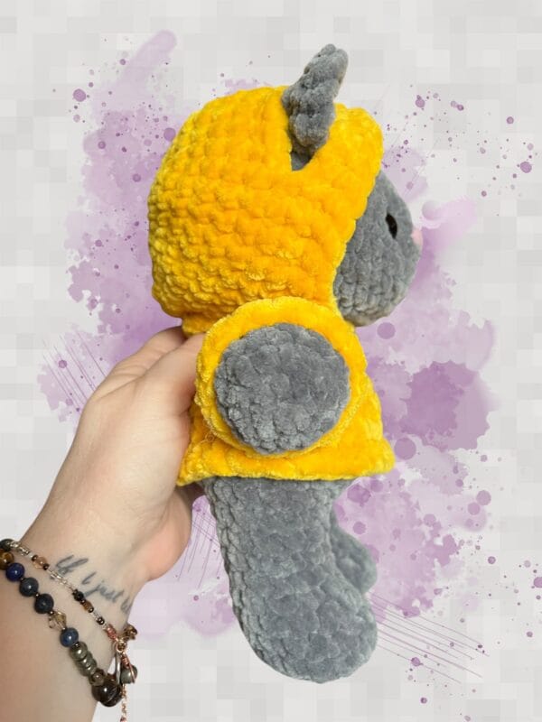 dark grey bear in a yellow hoodie