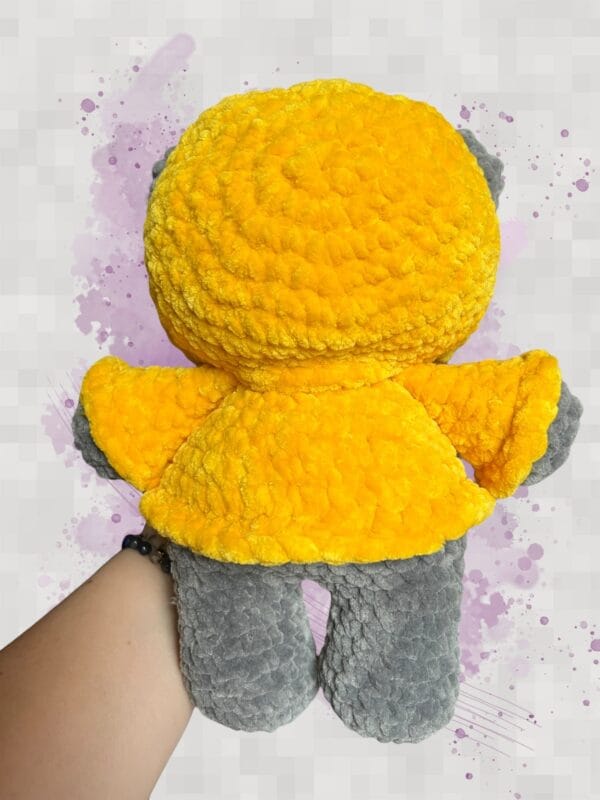 dark grey bear in a yellow hoodie