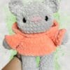 grey bear in a peach hoodie