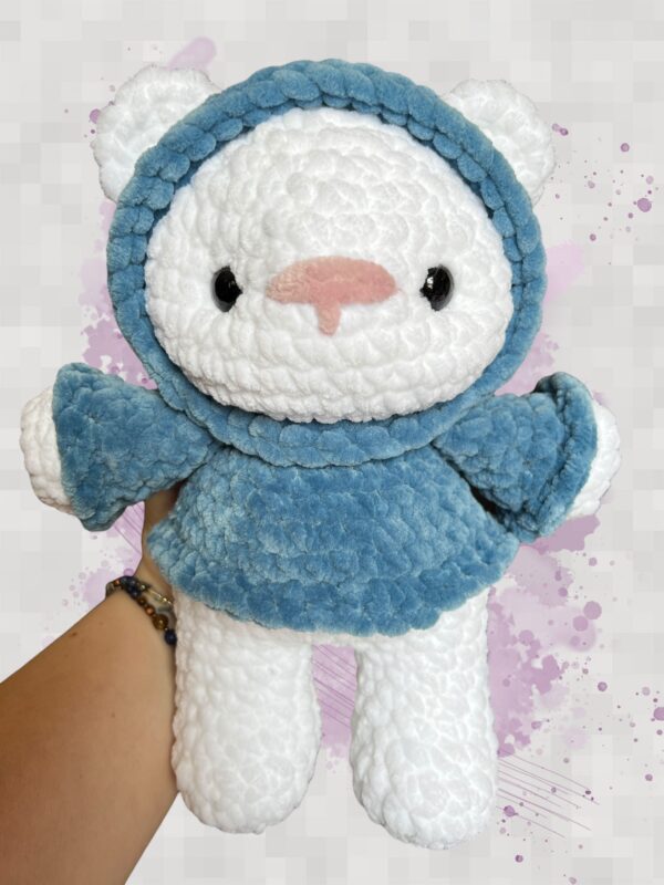 White plush bear in a blue hoodie