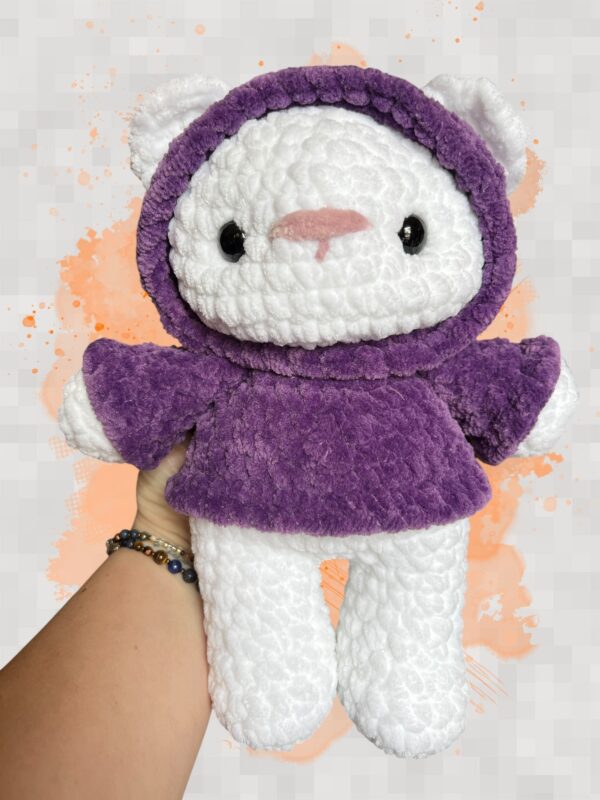 White crochet bear plushie in a purple hoodie - front view