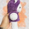 White crochet bear plushie in a purple hoodie - right view