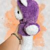 White crochet bear plushie in a purple hoodie - left view