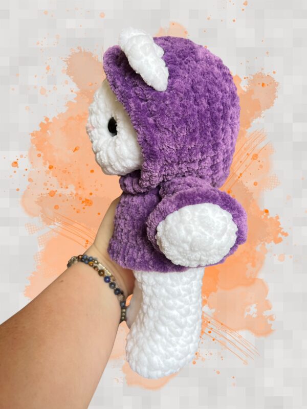 White crochet bear plushie in a purple hoodie - left view