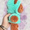 Rust crochet bear plushie in an aquamarine hoodie - right view