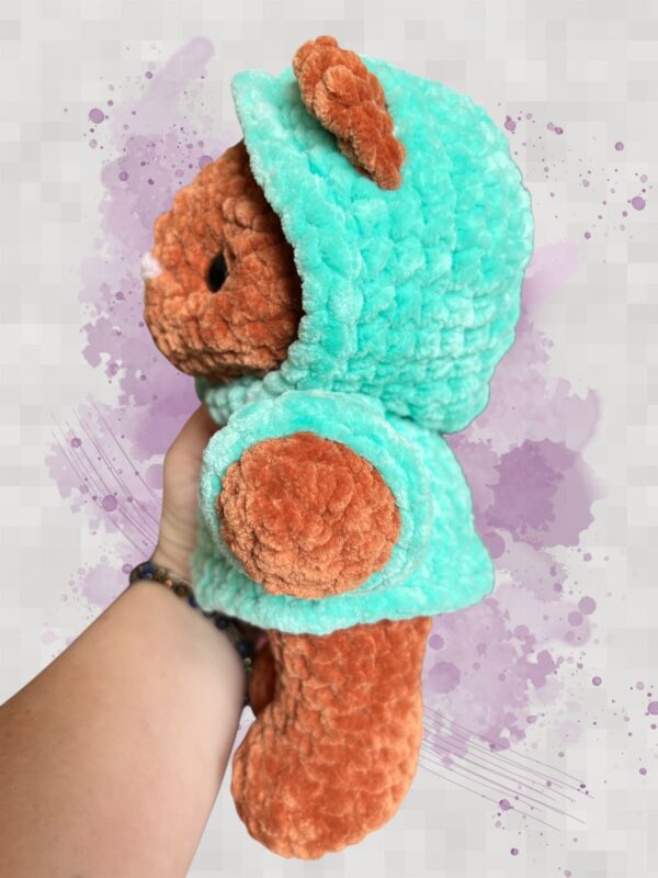 Rust crochet bear plushie in an aquamarine hoodie - left view