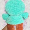 Rust crochet bear plushie in an aquamarine hoodie - back view