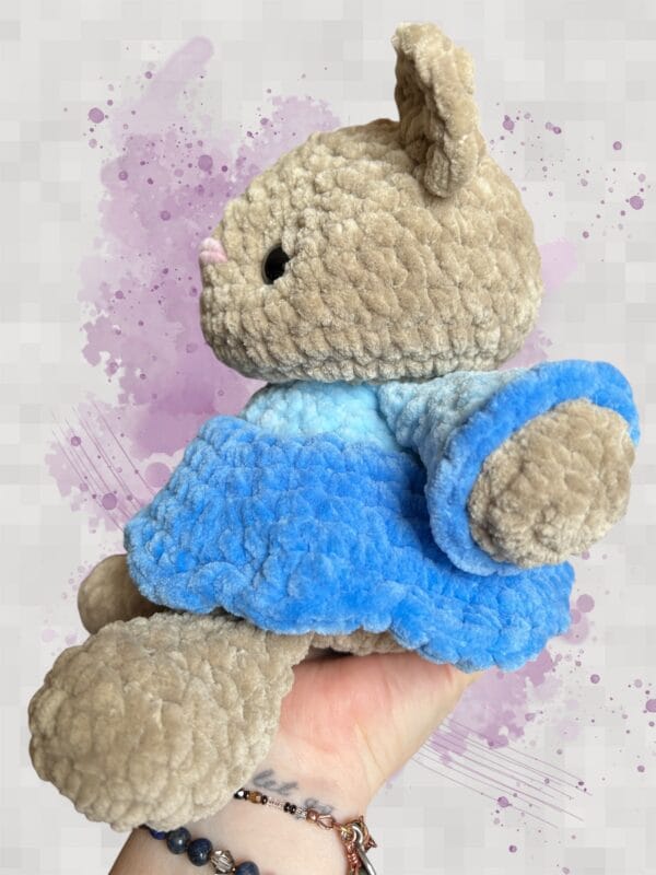 beige bear in a blue dress