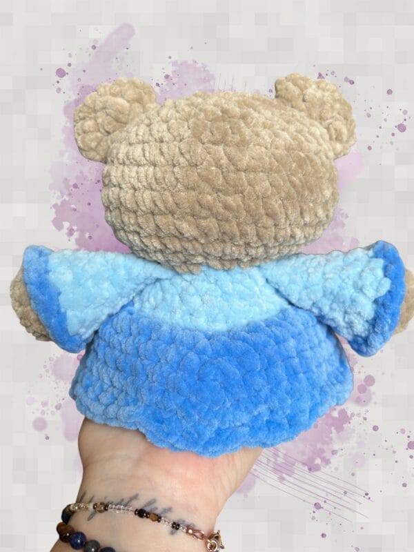 beige bear in a blue dress