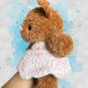 caramel brown bear in a pink & white dress