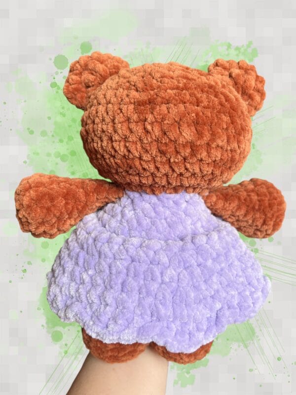 plush rust brown bear in a lavender dress