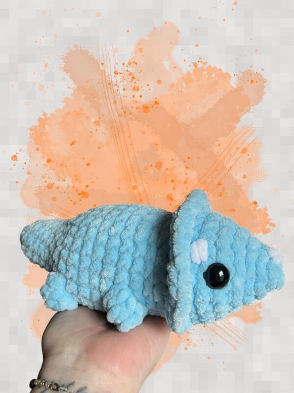 Triceratops lying down light blue